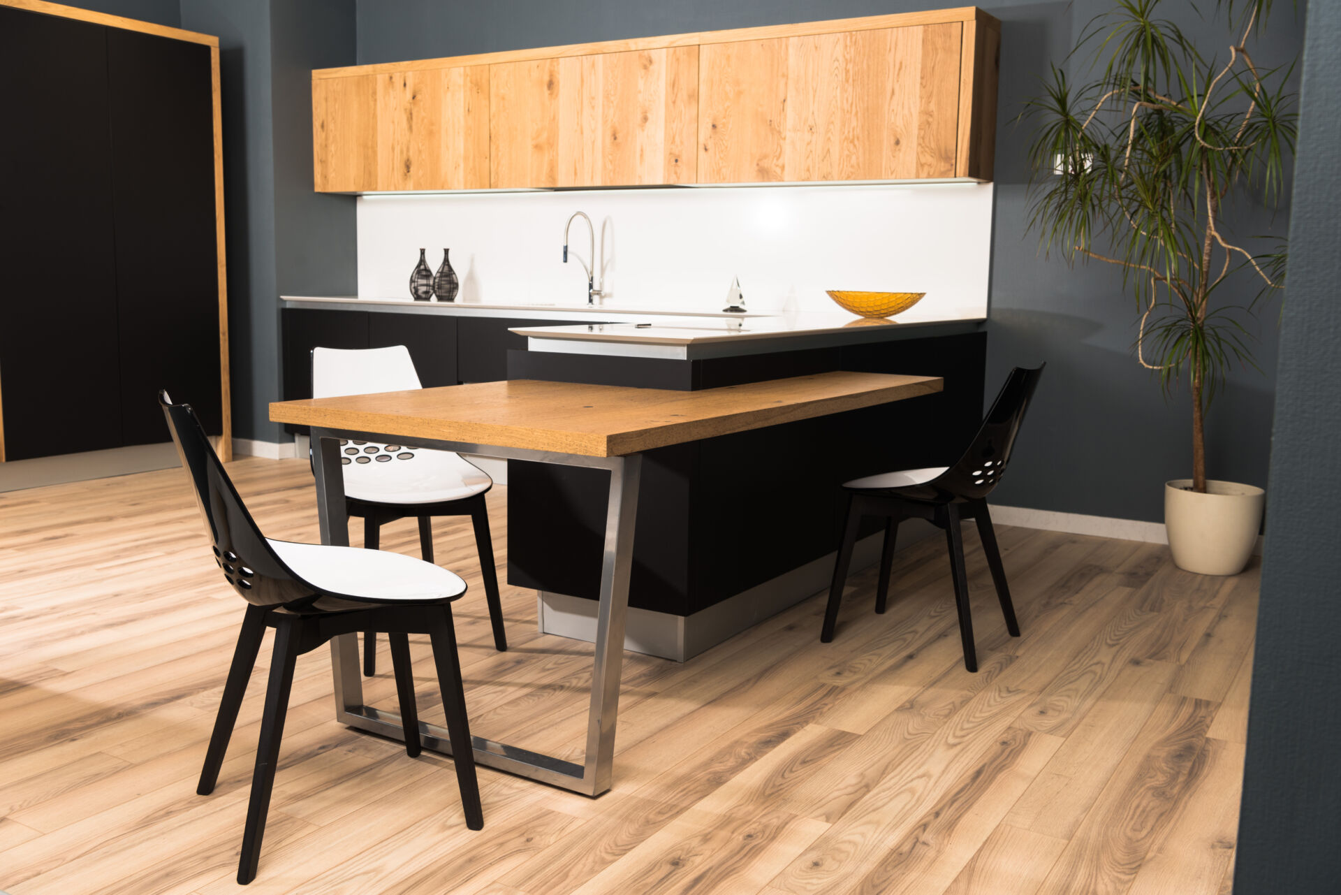 Interior of modern clean light kitchen with comfortable furniture with vinyl flooring