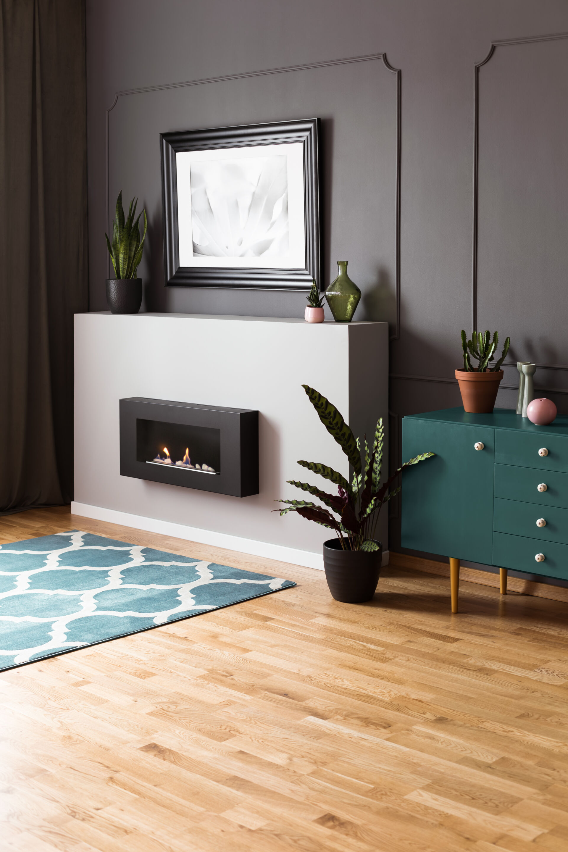 Fireplace and rug in living room and vinyl flooring